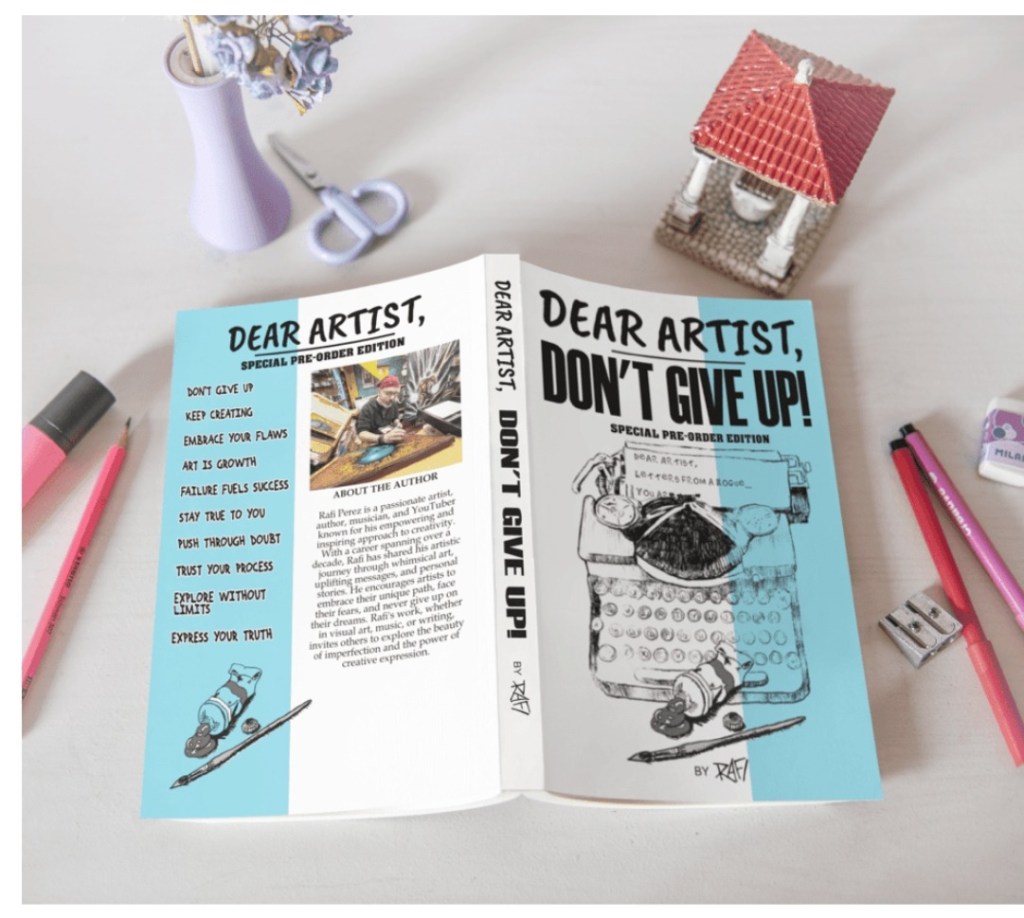 Cover of the book 'Dear Artist, Don't Give Up: Special Pre-Order Edition' featuring a light blue design with motivational phrases and an illustration of a typewriter, accompanied by pink pencils and a decorative item.