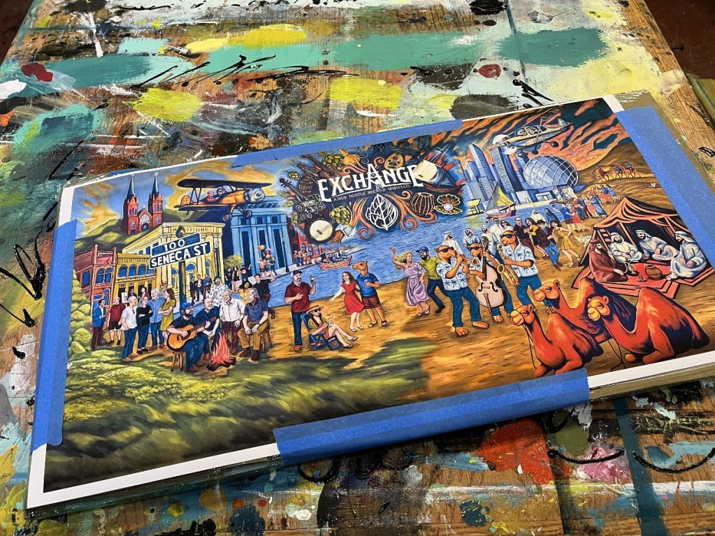 A partially completed mural showcasing vibrant scenes from Oil City, depicting people, local landmarks, and cultural elements, with blue painter's tape along the edges.